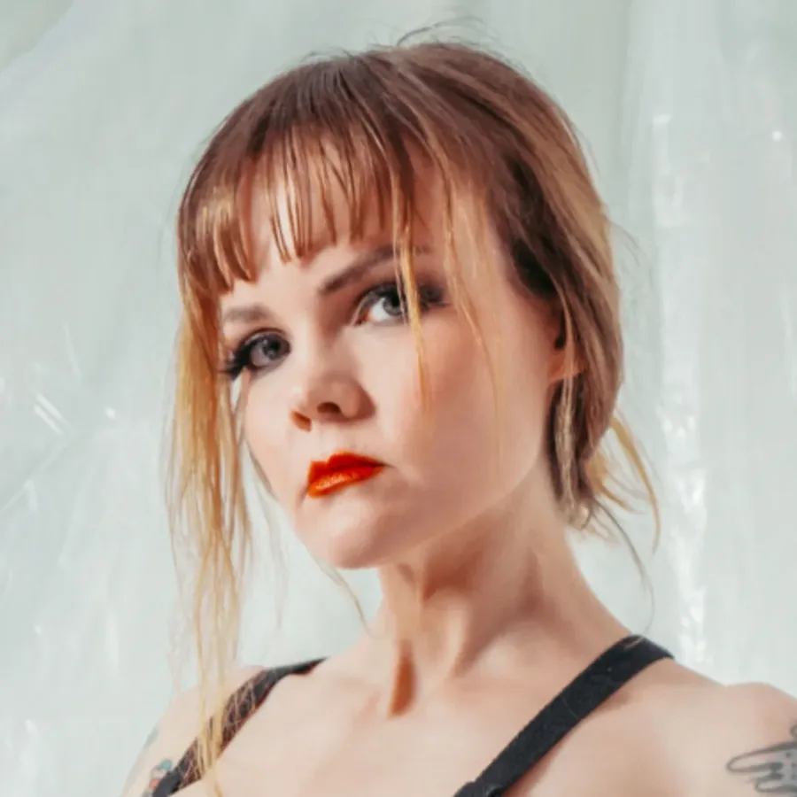 Public Bluesky promotional portrait of Mistress Petra Hunter.
